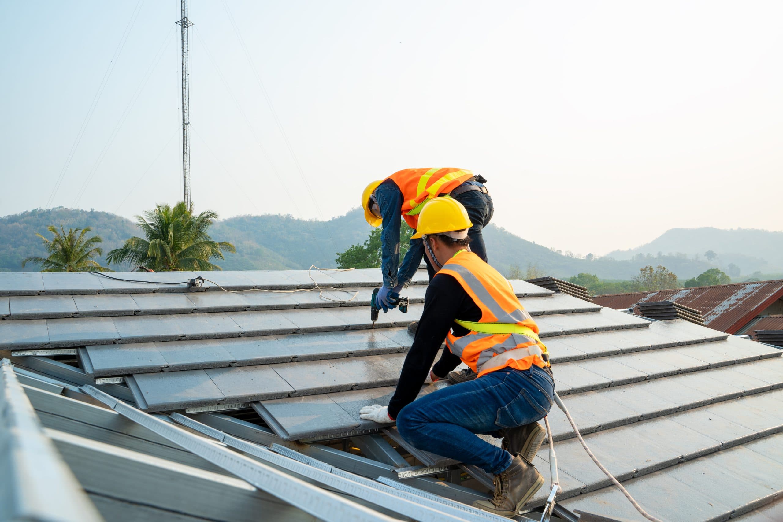Licensed Arizona roofing contractor working on a roof after storm damage