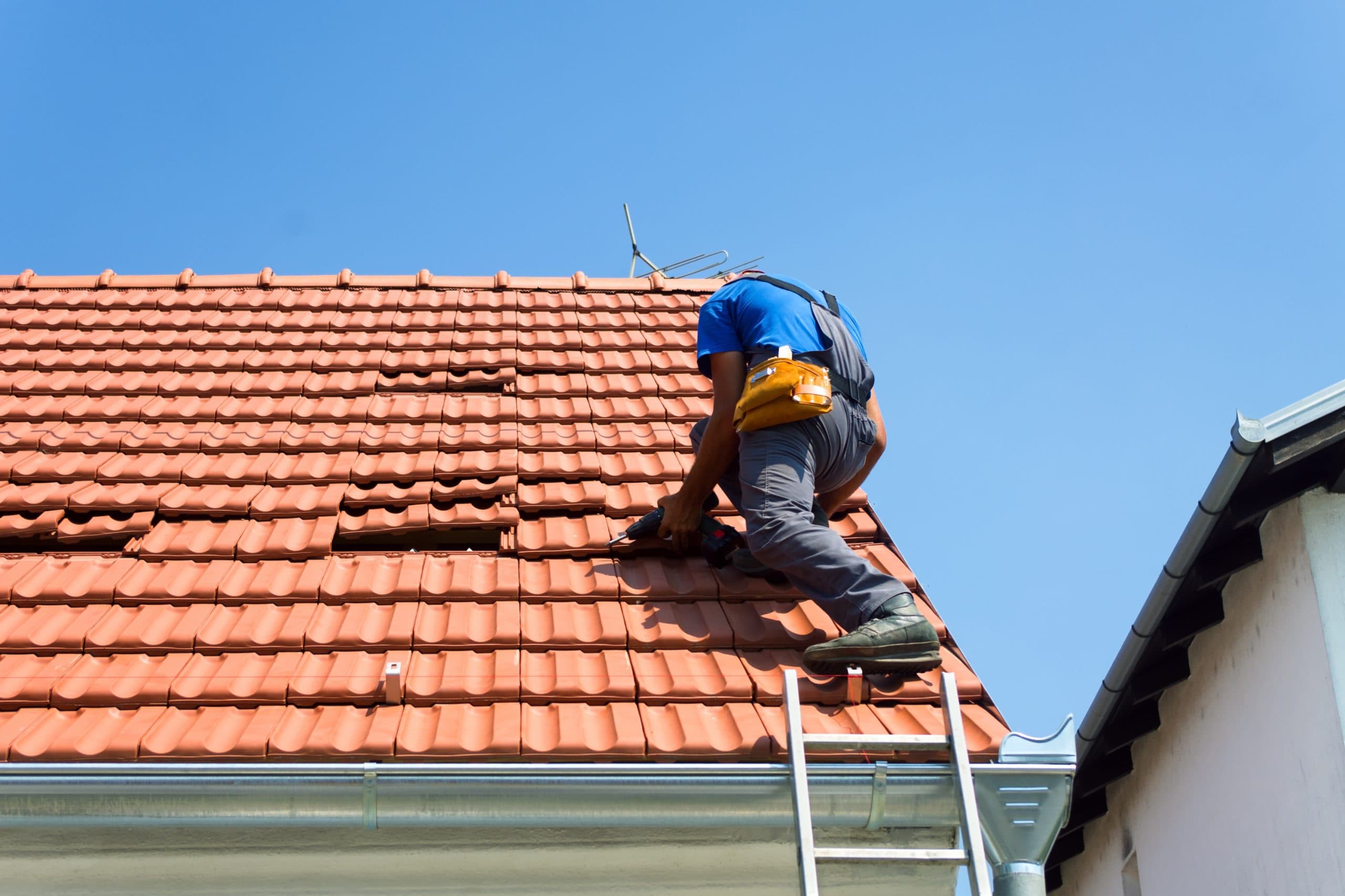 Arizona homeowner reviewing a roof insurance claim after a monsoon storm
