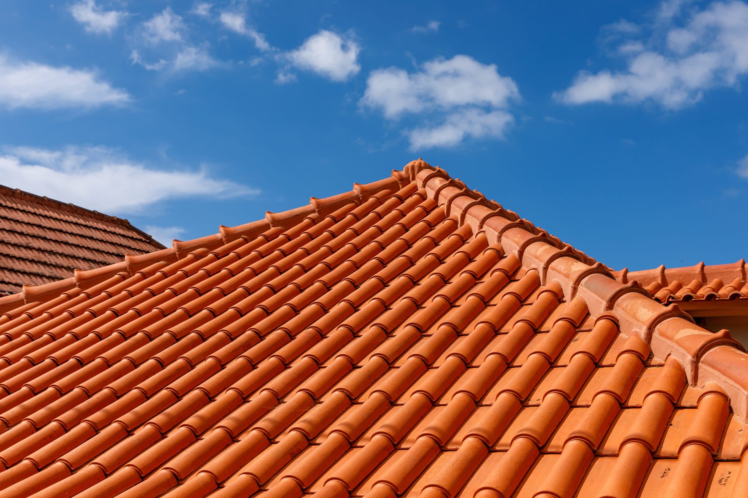 Concrete tile roof on an Arizona home under a clear blue sky
