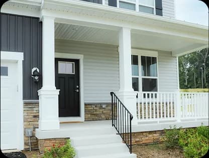 Freshly painted home exterior with crisp white trim